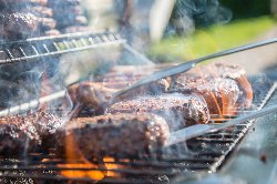 Hamburgers cooking on grill